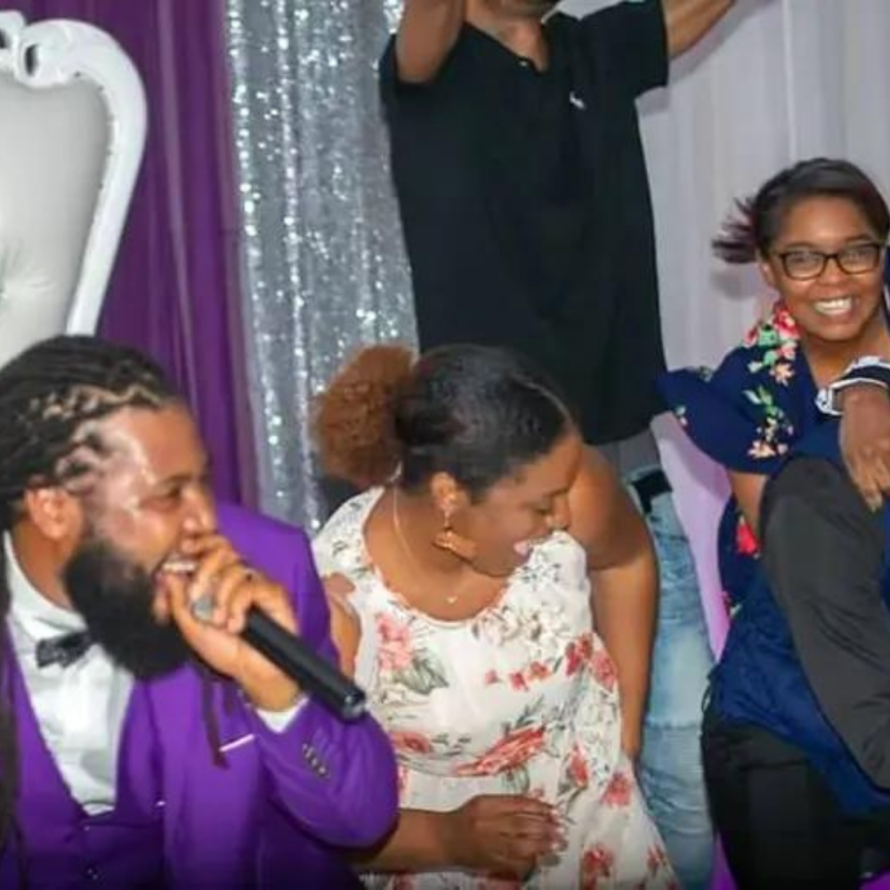 DJ Bush hosting a lively wedding reception with guests